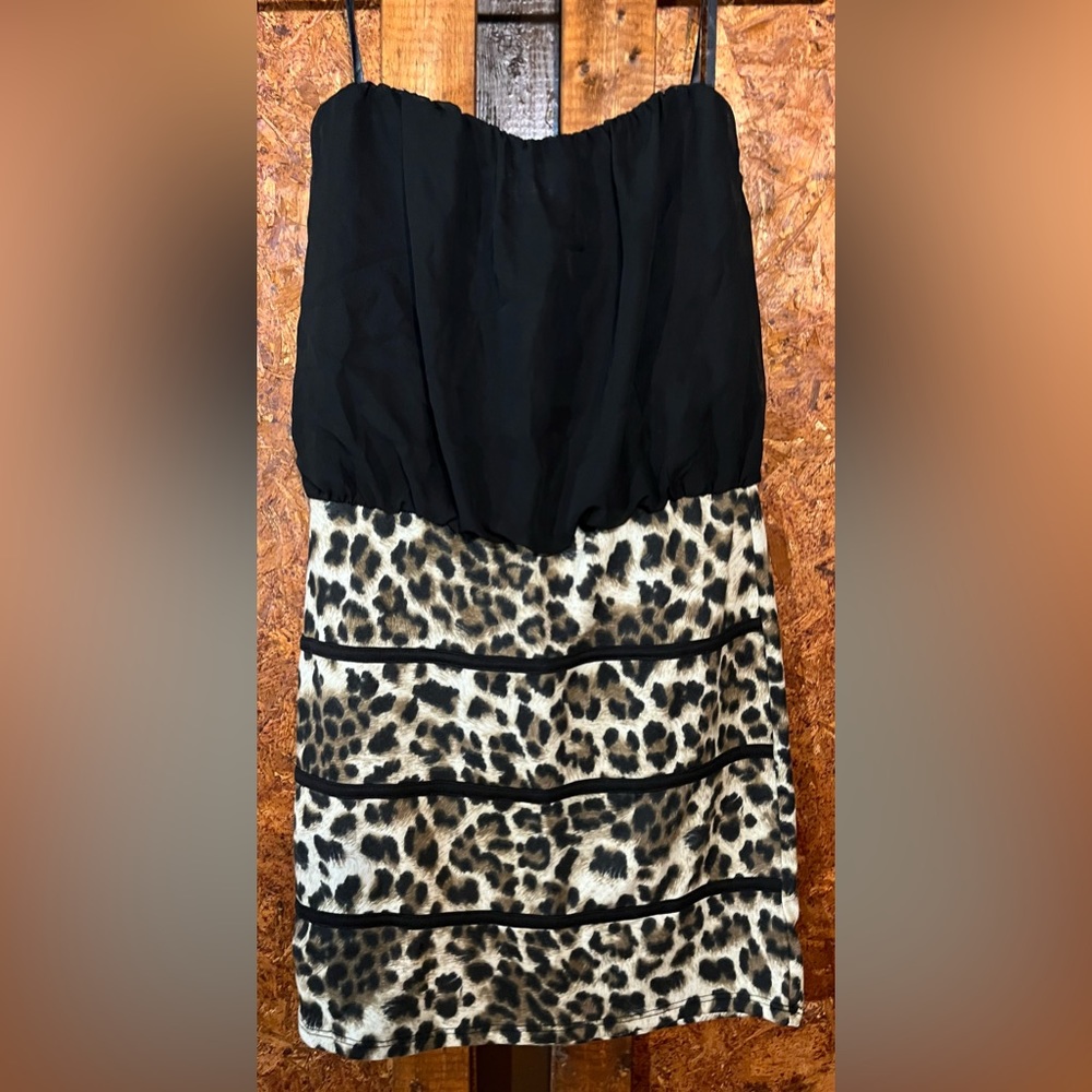 Short women’s medium dress with a black and cheetah pattern